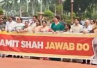 संसद के बाहर पोस्टर, अंदर हंगामा: ‘अमित शाह जवाब दो’ के नारे; लोकसभा-राज्यसभा की कार्यवाही स्थगित